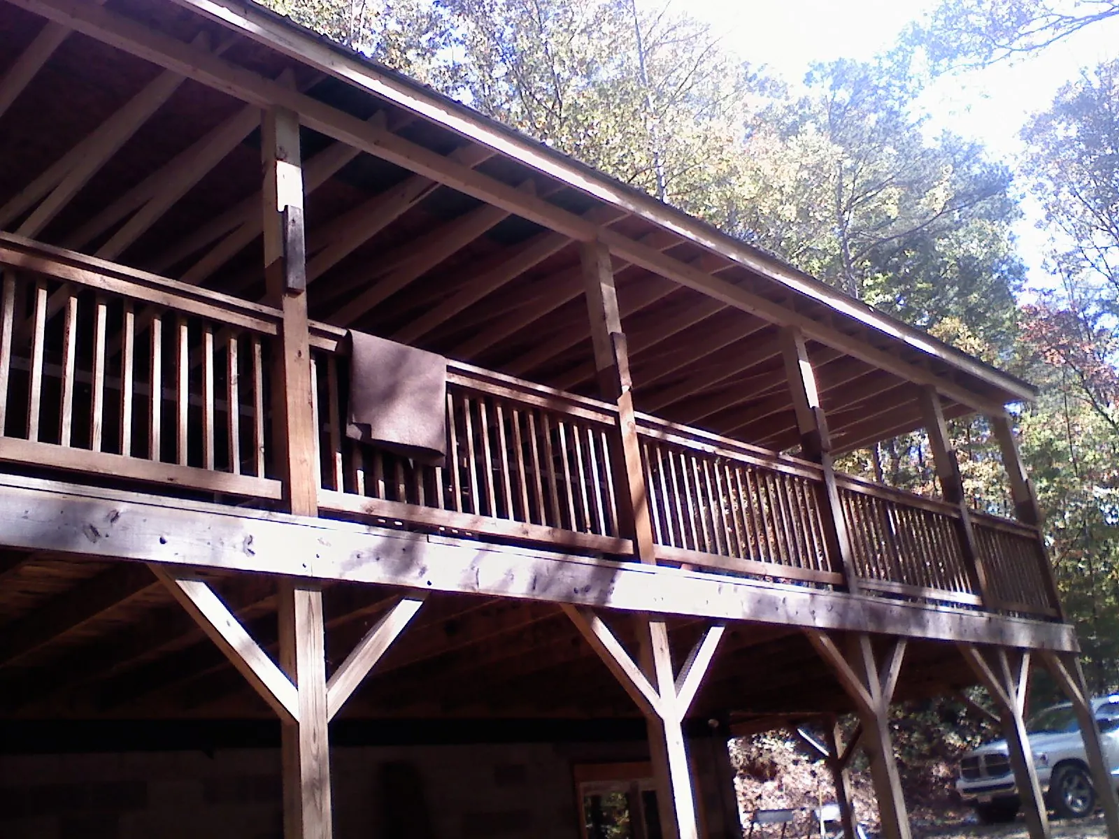 Timber framing under a new elevated porch and deck — Roof Leak Repair in Hopedale by Roofing Brothers